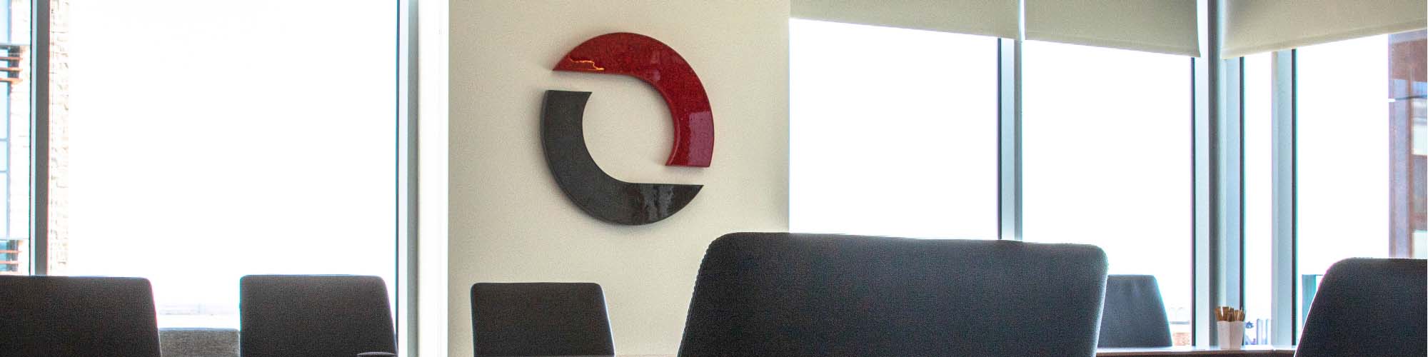 Omni Logistics headquarters board room with Omni logo sign on wall