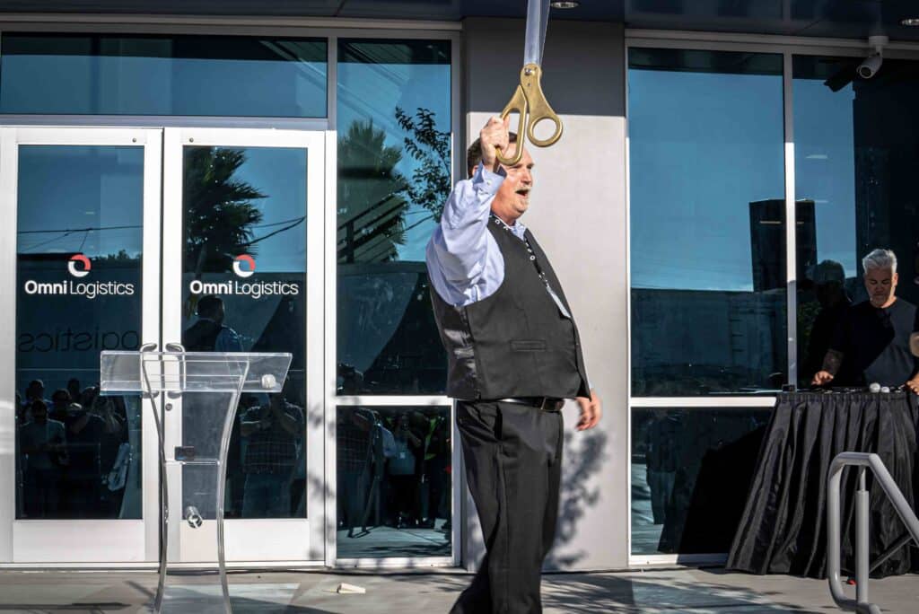 los angeles station manager celebrating ribbon cutting at new facility