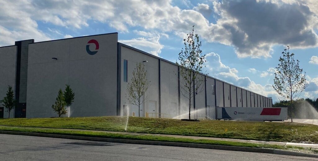 Omni Logistics Nashville Facility Front of Warehouse and Omni Trailer