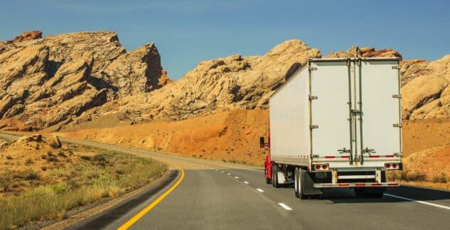 expedited semi truck driving in desert