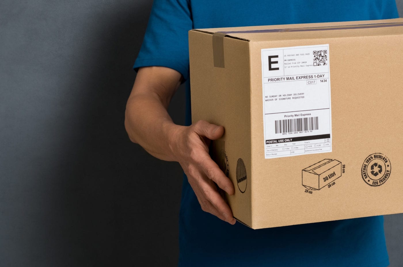 person holding box to ship