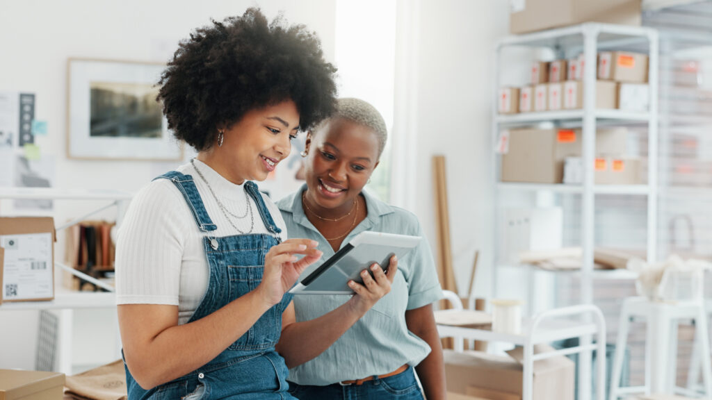 Shopping company, ecommerce logistics or business women on tablet with planning digital stock or cargo shipping delivery. Warehouse, supply chain or black woman consulting or learning from manager.