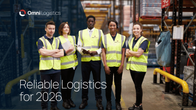 warehouse workers wearing neon vests standing in a semicircle smiling at the camera